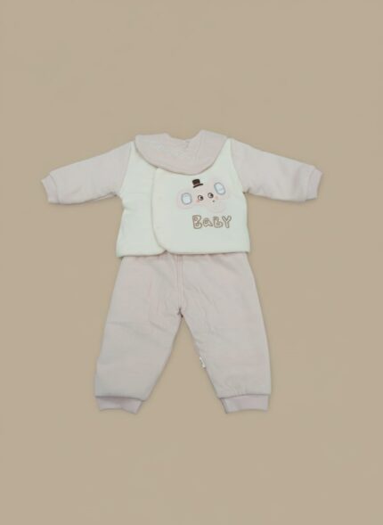 Pink newborn baby sweater set with an elephant design on a cream vest and matching ribbed pants, modeled by a smiling infant.
