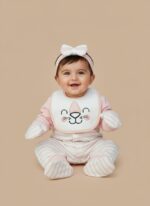 Pink and white striped baby girl layette set with an animal face bib, headband, and mittens, displayed folded.