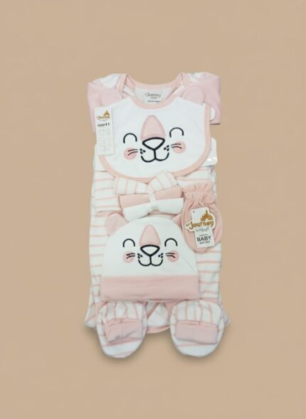 Pink and white striped baby girl layette set with an animal face bib, headband, and mittens, displayed folded.