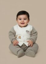 A two-piece grey and white Baby Warm Sweater Set with a quilted sweater featuring a puppy design and matching warm pants, displayed on a baby.