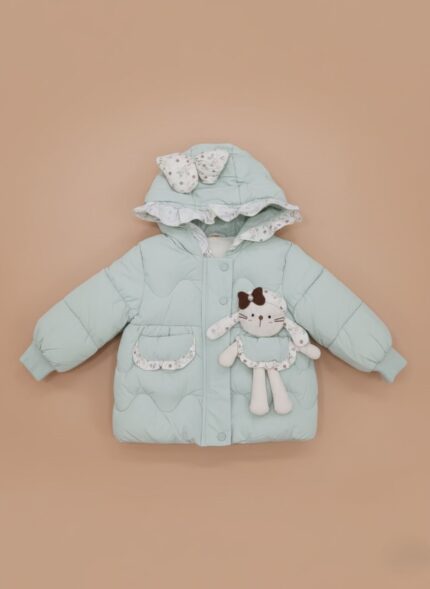 Mint green Baby Girls Quilted Jacket with hood, floral bow, and attached bunny plush toy on a light brown background.