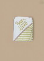 A newborn baby swaddled in a white blanket with green trim, featuring "YOU MAKE ME HAPPY" embroidered text, a teddy bear, an owl, and dinosaur patterns.