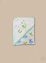 A newborn baby swaddled in a white blanket with green trim, featuring "YOU MAKE ME HAPPY" embroidered text, a teddy bear, an owl, and dinosaur patterns.