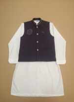 Boys clothes adventure set on child: navy performance tee, khaki trail shorts and UPF cap, outdoor nature backdrop