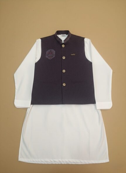 Boys clothes adventure set on child: navy performance tee, khaki trail shorts and UPF cap, outdoor nature backdrop