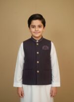 Boys clothes adventure set on child: navy performance tee, khaki trail shorts and UPF cap, outdoor nature backdrop