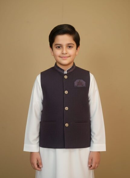 Boys clothes adventure set on child: navy performance tee, khaki trail shorts and UPF cap, outdoor nature backdrop