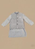 Boys clothes summer set on child: white cotton tee, camo cargo shorts and bucket hat, outdoor playground background