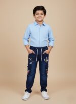 Navy blue boys cargo pants with white drawstring, graphic prints, and cargo pockets on a light background.