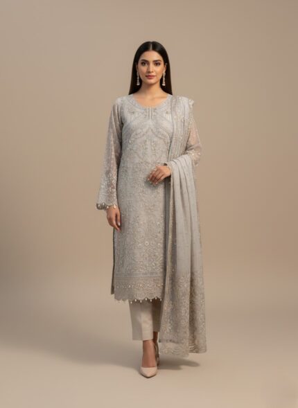 A flat-lay image of the Claire Price UNSTITCHED three-piece suit in off-white/ivory Organza, heavily decorated with silver and champagne embroidery and embellishments, alongside the matching raw silk trouser and slip fabric. Ideal for formal and party wear.