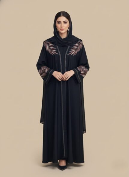 Sand-tone woman abaya in crepe, open-front kimono sweater style, side pockets and belt shown on model in daylight studio