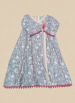 A flat lay showing a blue floral printed khaddar Angrakha style kurta with white and pink floral designs, pink lace trim, a tassel, and a folded matching printed khaddar dupatta.