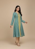 Blue women's printed frock with golden patterns and intricate detailing, front view on a plain background.