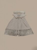 embroidered maxi dress with silver sequins and intricate lace detailing on the hem, accompanied by a matching white dupatta, displayed on a light brown background.