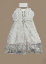 embroidered maxi dress with silver sequins and intricate lace detailing on the hem, accompanied by a matching white dupatta, displayed on a light brown background.