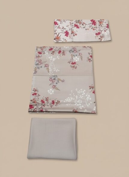 Full-length image of a woman wearing a beige Floral Embroidered Woolen Suit with red and pink floral patterns. The suit is unstitched, featuring a long shirt, trousers, and a dupatta, all made of warm wool fabric.