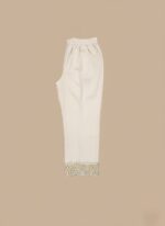 Off-white Women's Embroidered Trouser with intricate floral embroidery on the hem, lying flat against a beige background, highlighting the detail and fabric.