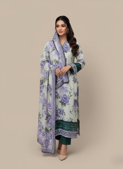 Model in a purple floral printed lawn dress, a three-piece summer collection with green contrasting hem and cuffs, and a matching purple floral patterned dupatta.