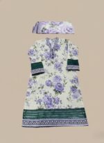 Model in a purple floral printed lawn dress, a three-piece summer collection with green contrasting hem and cuffs, and a matching purple floral patterned dupatta.