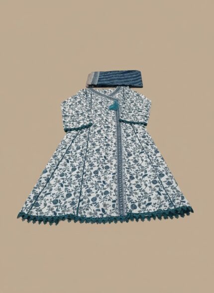 A woman wearing a white and teal floral printed khaddar Angrakha style suit with a long-sleeved, flared kurta, matching teal trousers, and a coordinating printed khaddar dupatta draped over her head.