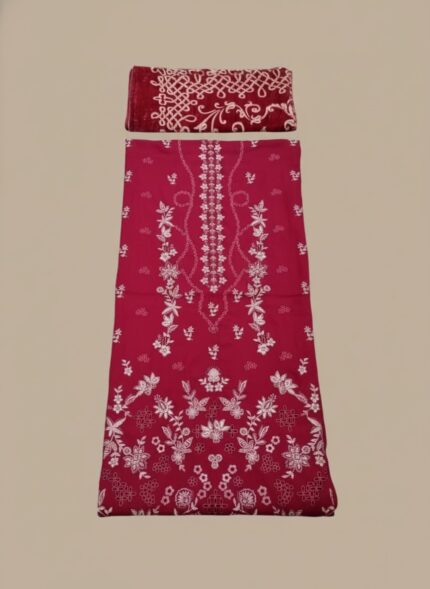 A flat lay showing a maroon embroidered lawn suit with a shirt piece and a folded matching embroidered dupatta. The fabric features intricate white floral and geometric embroidery patterns.