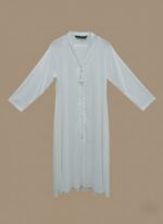 Sand-tone woman abaya in soft crepe, open-front kimono sweater style, side pockets and belt shown on model against neutral backdrop