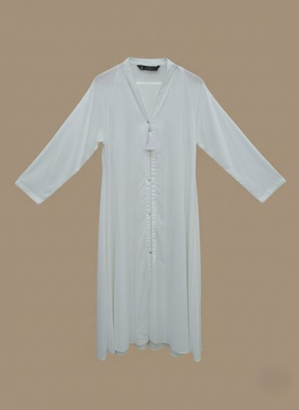 Sand-tone woman abaya in soft crepe, open-front kimono sweater style, side pockets and belt shown on model against neutral backdrop