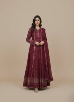 Fuchsia Chikankari maxi dress or Anarkali with silver embroidery and sequin/mirror work, laid flat on a neutral background, showcasing the full length of the long garment.
