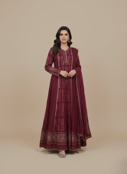 Fuchsia Chikankari maxi dress or Anarkali with silver embroidery and sequin/mirror work, laid flat on a neutral background, showcasing the full length of the long garment.