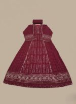 Fuchsia Chikankari maxi dress or Anarkali with silver embroidery and sequin/mirror work, laid flat on a neutral background, showcasing the full length of the long garment.