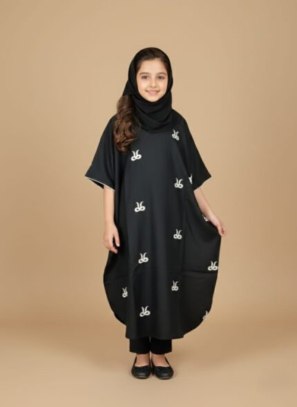Image of a young girl wearing a black embroidered kids kaftan dress with white patterns.