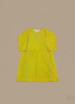 Handmade embroidered yellow tunic dress with traditional stitching on a neutral background.