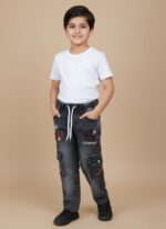 Kids black cargo jeans with colorful embroidery, white drawstring, and side pockets on a plain background.