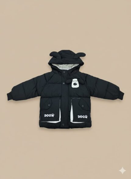 Front view of a young child wearing a black Kids Dog Puffer Jacket with a hood featuring dog ears and a white dog graphic on the chest, along with pockets marked "DOG" with a paw print.