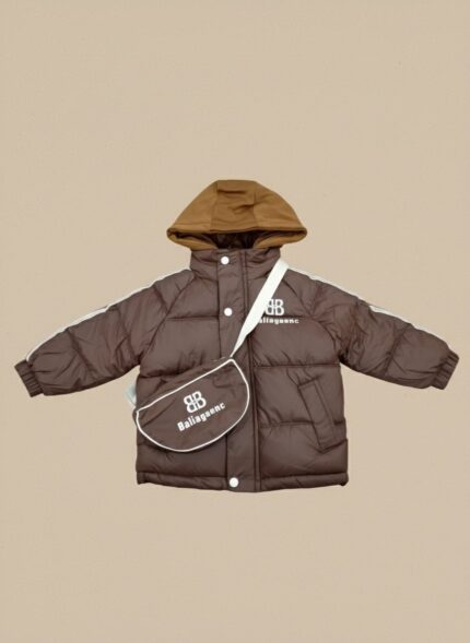Front view of a young child wearing a brown Baliagaenc Kids' Puffer Jacket with white sleeve stripes, a "BB" logo, a brown hood, and a matching Baliagaenc crossbody bag.