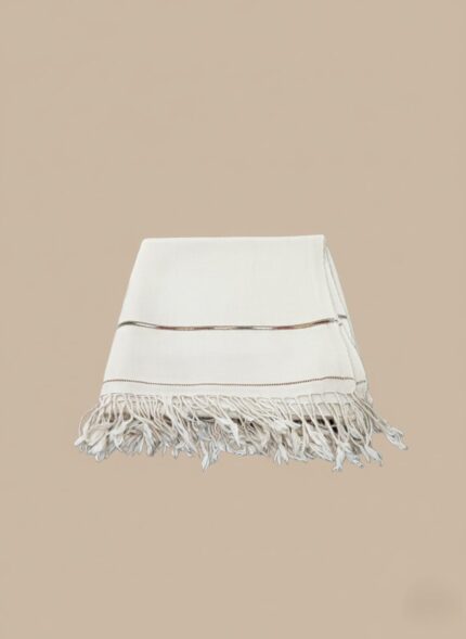 Folded white men's shawl with fringes and subtle stripe detail