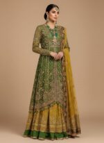Unstitched 3-piece Pakistani Wedding Dress ensemble. Olive green organza fabric with heavy silver and gold hand-embellished embroidery and a sequined yellow organza dupatta.