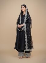 Flat lay of unstitched Black Embroidered Organza Suit fabric, showing the heavily embroidered organza shirt material and the separate, elegantly bordered organza dupatta fabric.