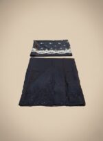 Flat lay of unstitched Black Embroidered Organza Suit fabric, showing the heavily embroidered organza shirt material and the separate, elegantly bordered organza dupatta fabric.