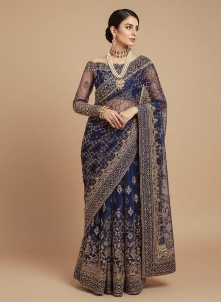Unstitched 3-piece navy blue embroidered net dress suit set. The fabric features intricate white traditional embroidery on the bottom edge and an ornate embroidered net front. A folded geometric patterned embroidered net dupatta is placed above the shirt fabric.