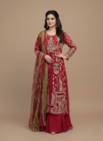 Close-up of a red hand embellished net bridal outfit with heavy silver and gold embroidery, paired with a vibrant green and red striped organza dupatta. Includes embroidered bodice, panels on net, cotton inner, and raw silk trouser.