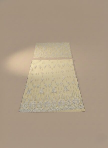 Pale yellow embroidered net sharara suit fabric laid flat, showing the heavily embellished shirt panels and borders for a formal Pakistani/Indian outfit.