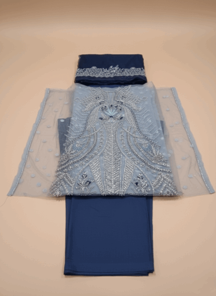 Maryam Hussain Gulaab Chandni Embroidered Wedding Collection Suit in blue, with silver sequin and hand embroidery on net, an embroidered organza dupatta, and foil-printed raw silk trousers, worn by a female model.