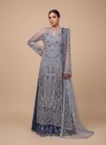 Maryam Hussain Gulaab Chandni Embroidered Wedding Collection Suit in blue, with silver sequin and hand embroidery on net, an embroidered organza dupatta, and foil-printed raw silk trousers, worn by a female model.