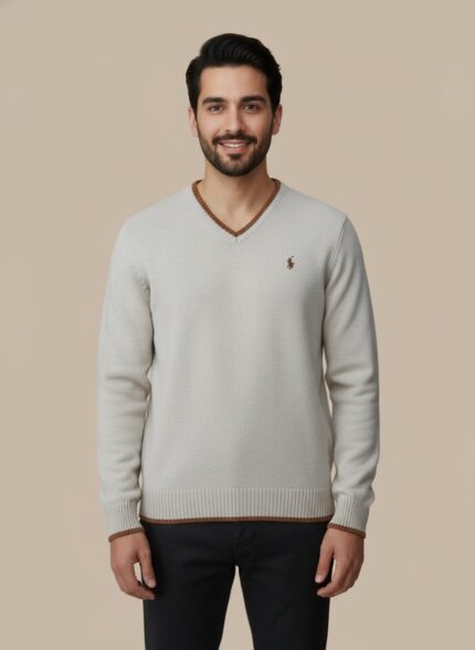 Men's beige V-neck sweater with brown striped trim on the collar, cuffs, and hem, worn by a model.