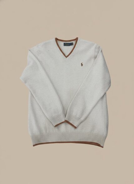 Men's beige V-neck sweater with brown striped trim on the collar, cuffs, and hem, worn by a model.