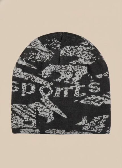 Image of a man wearing a black beanie with a grey abstract pattern and the word "SPORTS" knitted into the design.