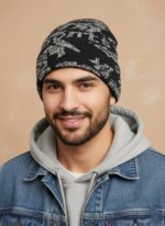 Image of a man wearing a black beanie with a grey abstract pattern and the word "SPORTS" knitted into the design.