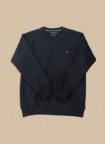 Men's black textured crew neck sweater with a subtle all-over pattern, displayed on a model, highlighting its classic appeal and comfortable fit.