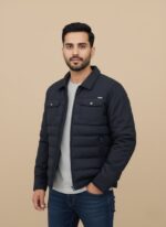 Men's dark blue puffer jacket, lightweight quilted winter coat with full zip and chest pockets on a light background.